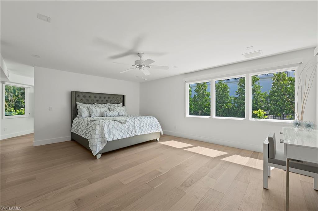 71 18th Avenue South Naples, FL 34102 - Photo 24 of 50 a bedroom with a large bed and a window