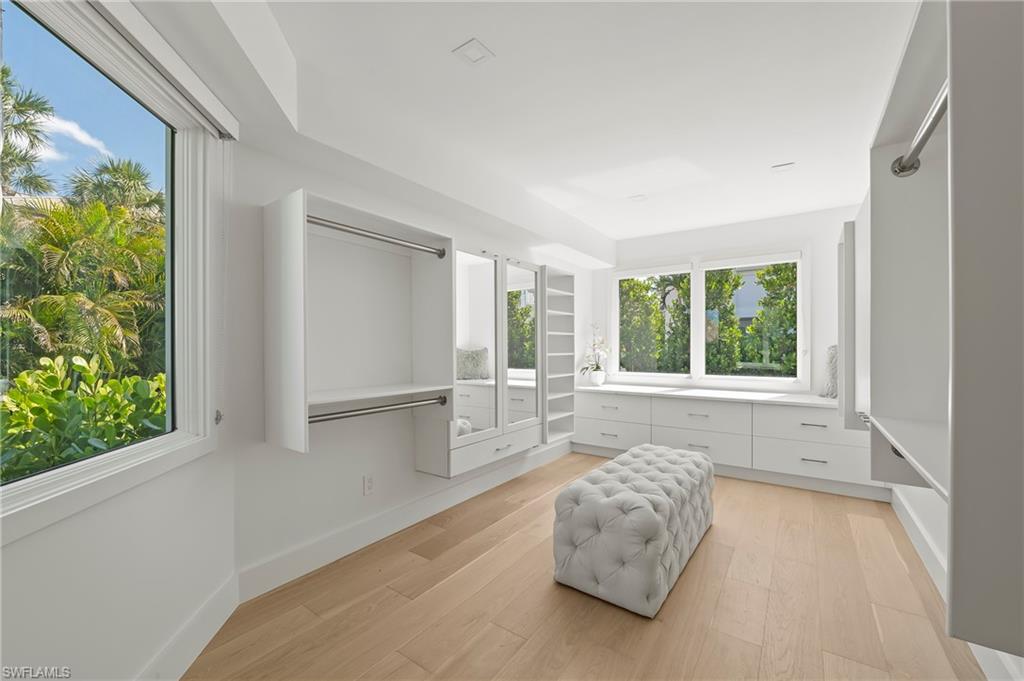 71 18th Avenue South Naples, FL 34102 - Photo 25 of 50 a room with a bed and a large window