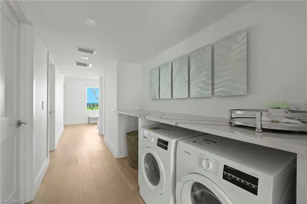 a view of entryway with washer and dryer