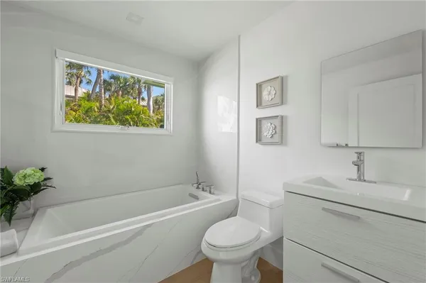 a bathroom with a sink toilet and bathtub