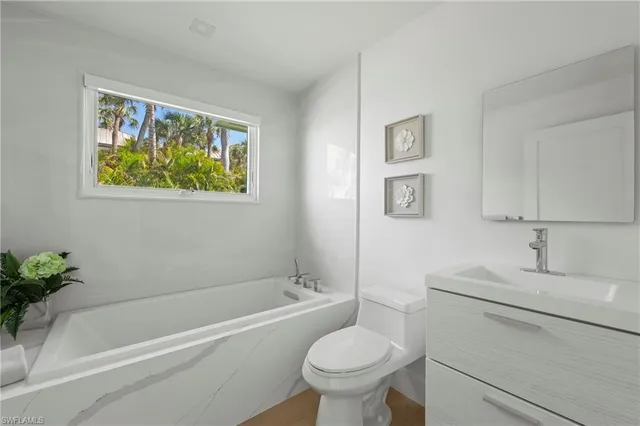 a bathroom with a sink toilet and bathtub