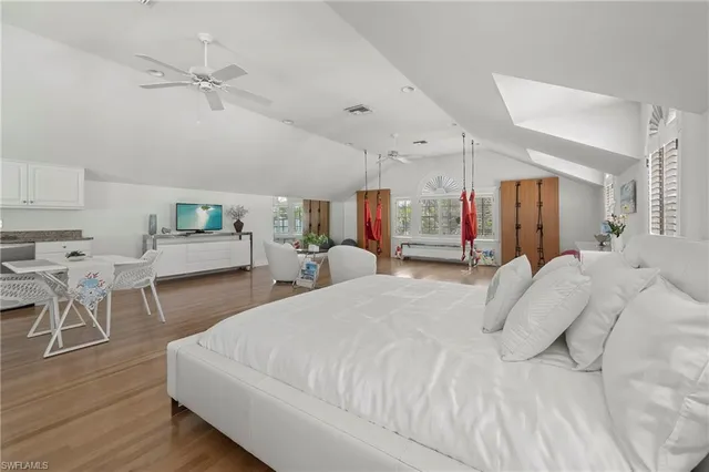 a bed room with a bed and a chair