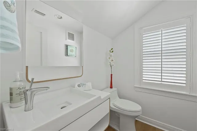 a bathroom with a sink and a toilet