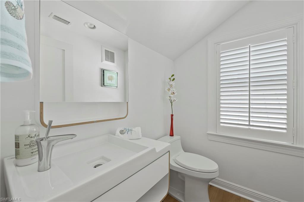 71 18th Avenue South Naples, FL 34102 - Photo 38 of 50 a bathroom with a sink and a toilet