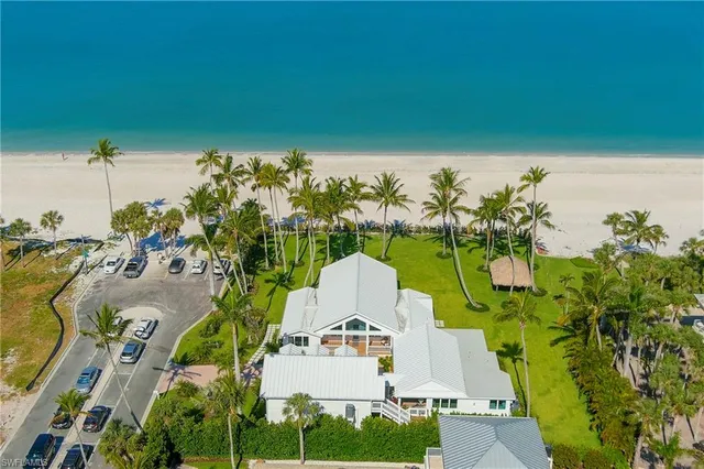 an aerial view of a house with a swimming pool