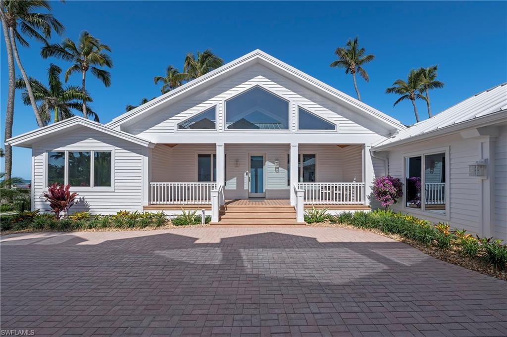71 18th Avenue South Naples, FL 34102 - Photo 7 of 50 front view of a house with a porch