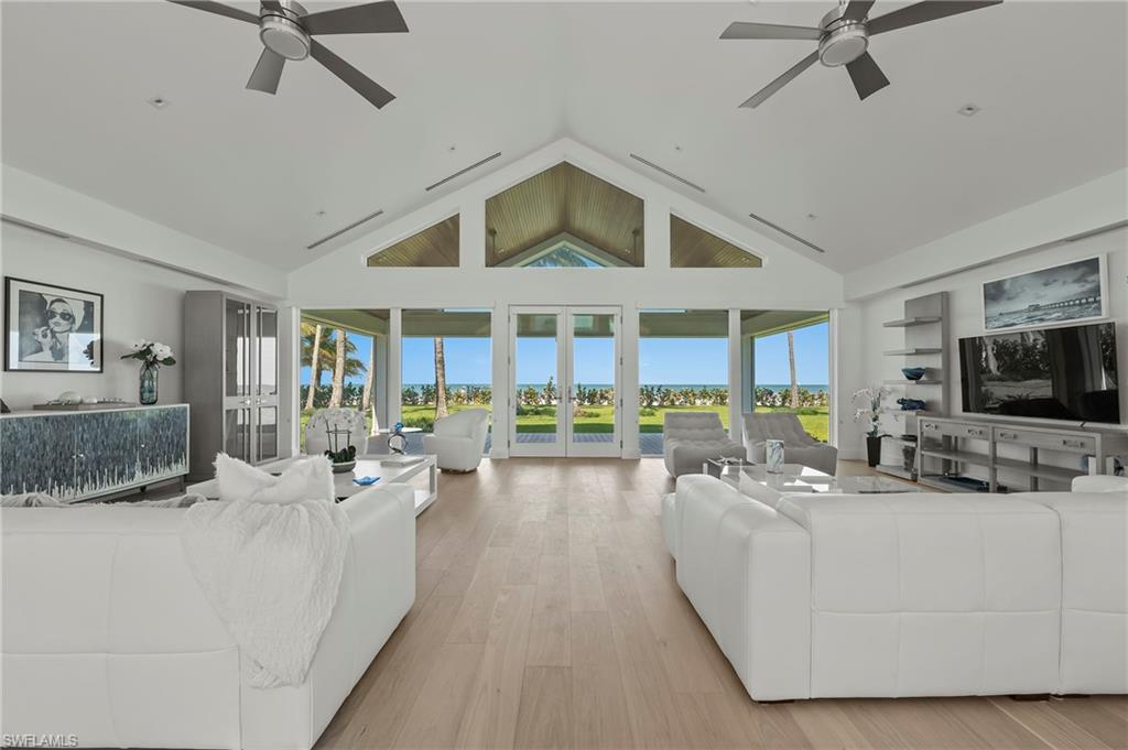 71 18th Avenue South Naples, FL 34102 - Photo 9 of 50 a living room with furniture and a flat screen tv