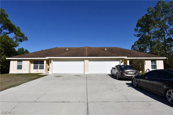 a view of a car parked in front of a house
