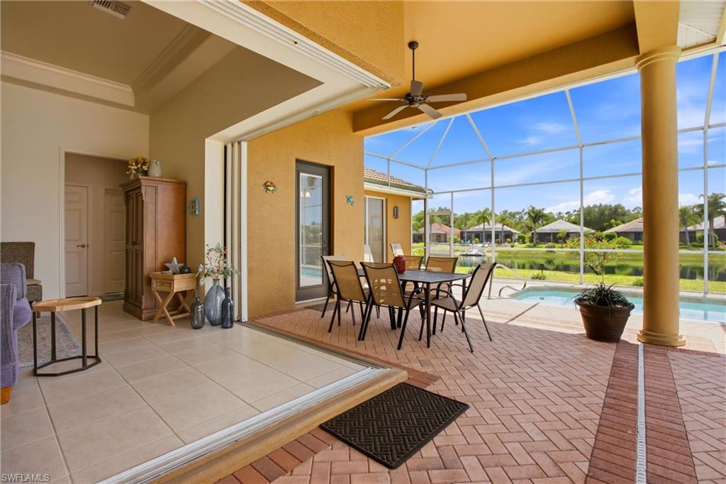 10815 Phoenix Way Naples, FL 34119 - Photo 8 of 40 a view of a dining room with furniture window and outside view
