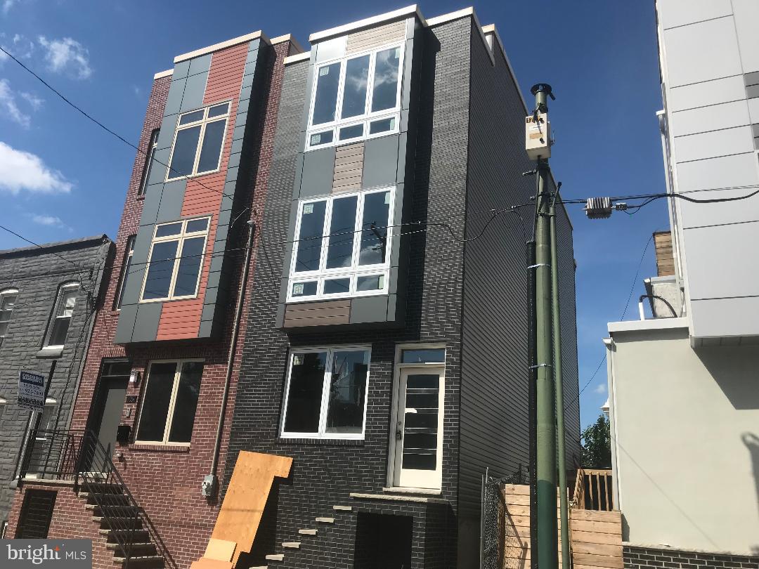 a front view of a building with many windows