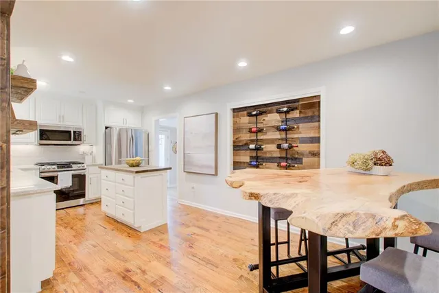 a kitchen with a table and chairs in it