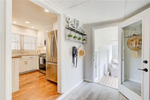 a kitchen with a refrigerator and a stove