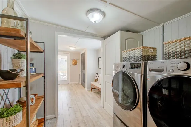 a view of a kitchen with washer and dryer