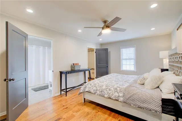 a bedroom with a bed and a table in it