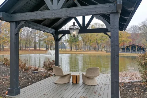 a bathroom with a toilet mirror and window