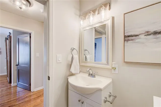 a bathroom with a sink a mirror and a shower