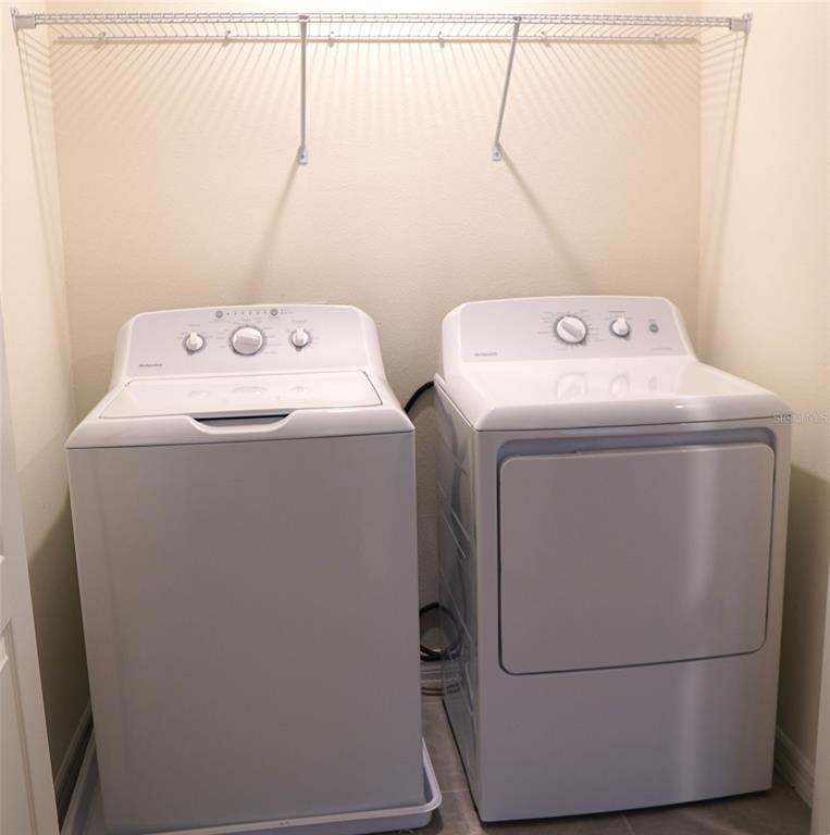 4079 Malawi Trail St. Cloud, FL 34772 - Photo 16 of 19 a utility room with dryer and washer