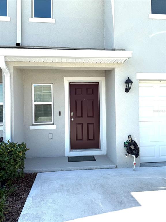 4079 Malawi Trail St. Cloud, FL 34772 - Photo 3 of 19 a view of an entryway of house