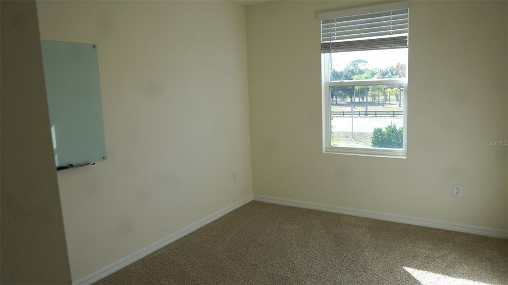 4079 Malawi Trail St. Cloud, FL 34772 - Photo 10 of 19 an empty room with a window