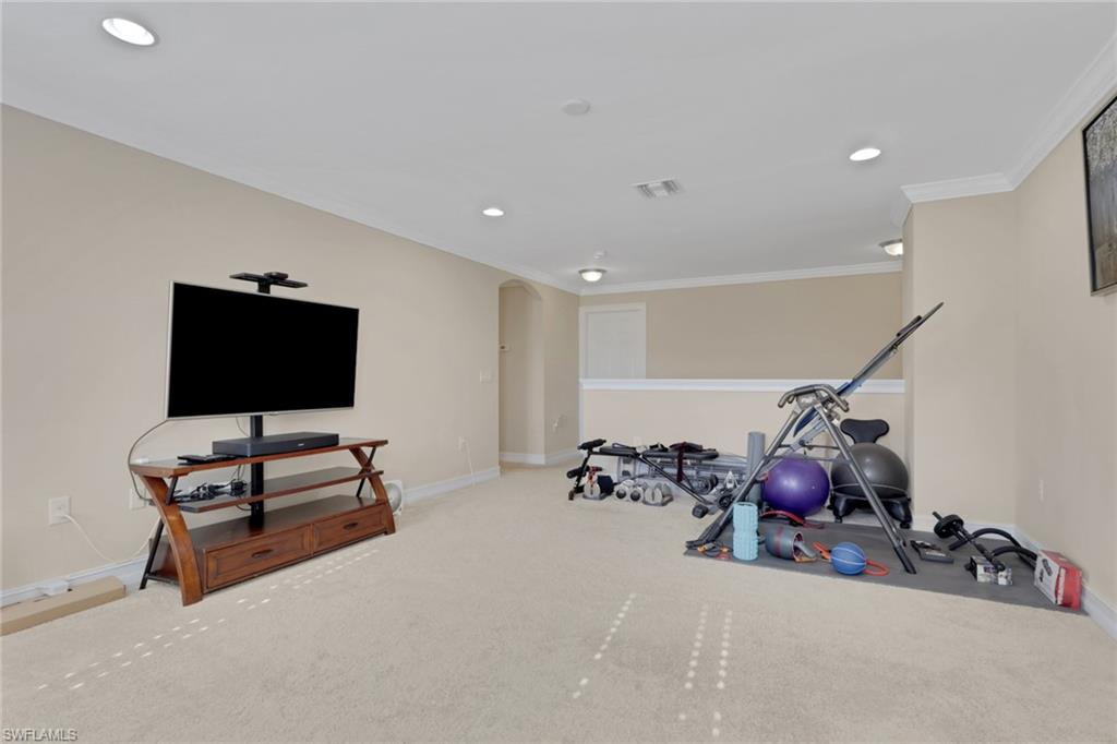 16309 Aberdeen Way Naples, FL 34110 - Photo 28 of 34 a living room with furniture and a flat screen tv