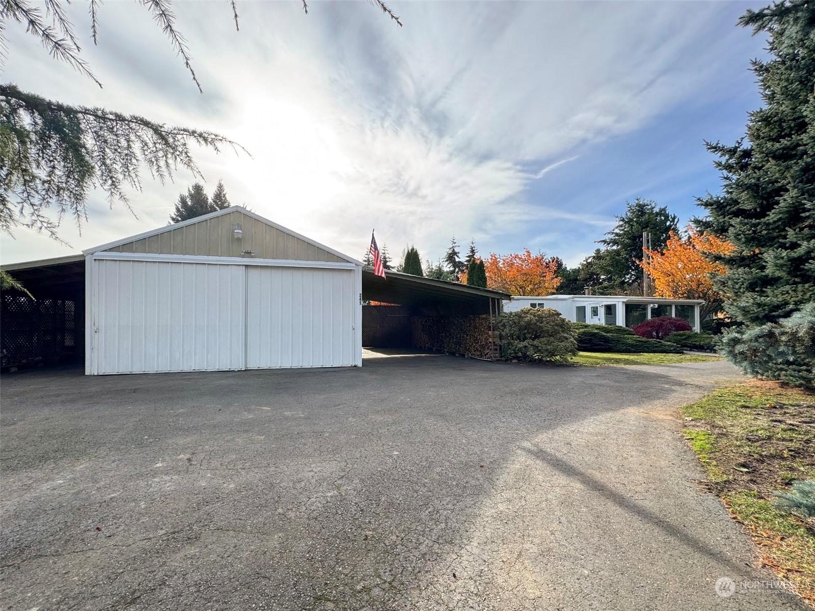 241 Evans Road Sequim, WA 98382 - Photo 2 of 40 a view of house with outdoor space and a car park in front of it