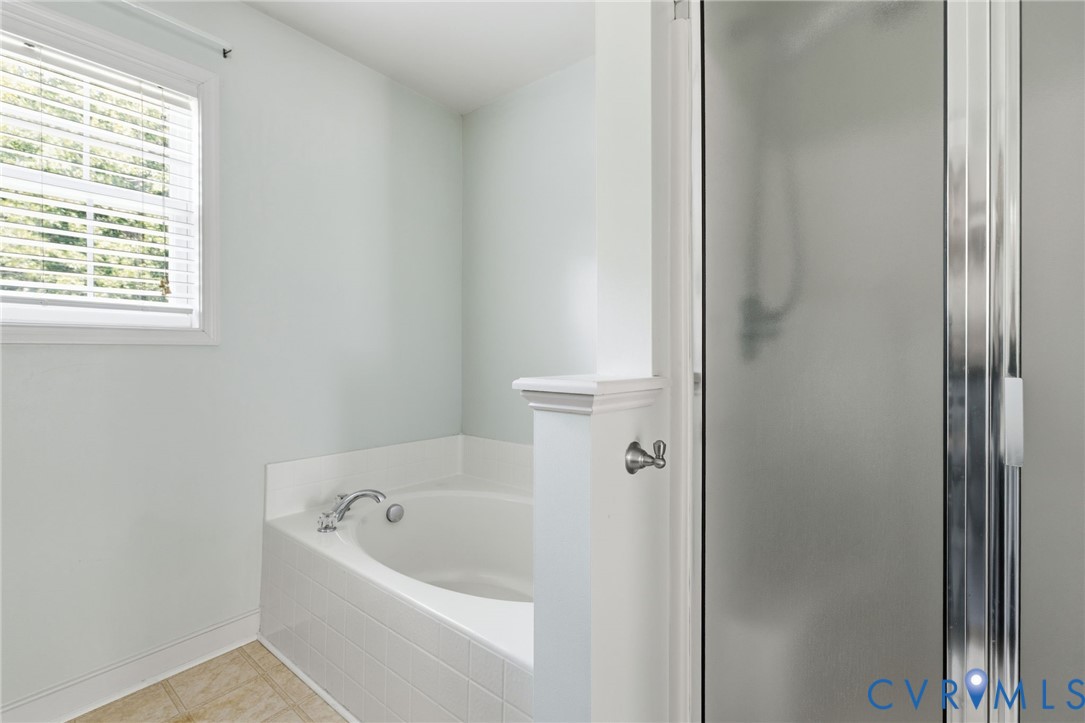 13524 Mountcastle Road Chesterfield, VA 23832 - Photo 21 of 44 Soaking tub with tile surround, brushed nickel fix