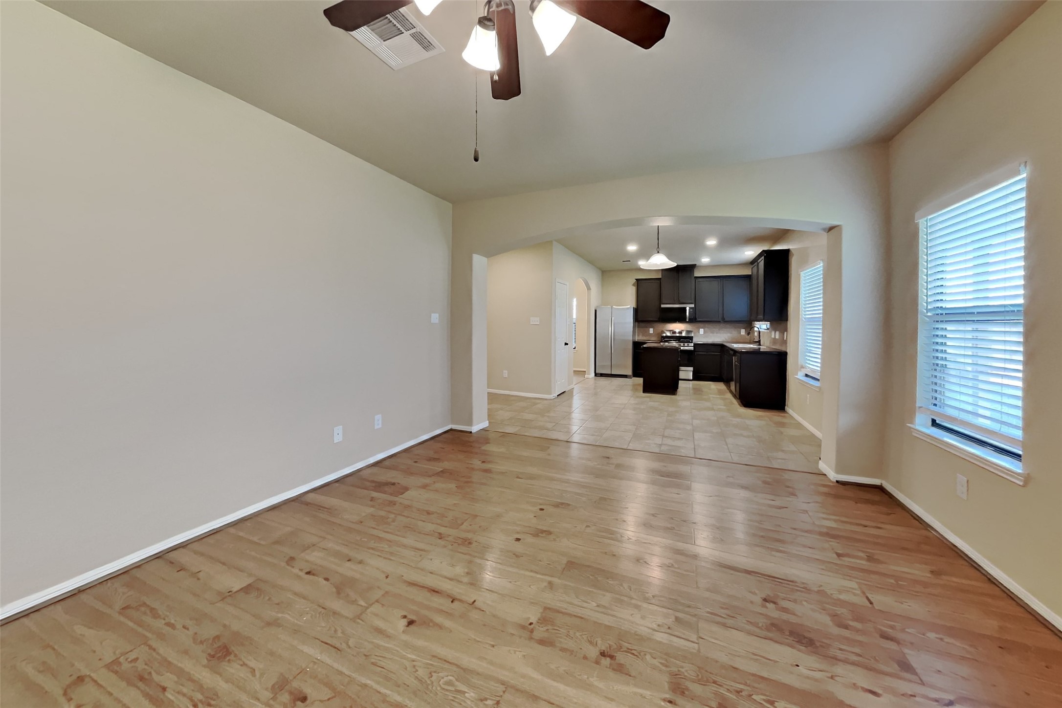 19715 Seabury Path Ct. Katy, TX 77449 - Photo 5 of 20 a view of a livingroom with hardwood floor and a ceiling fan