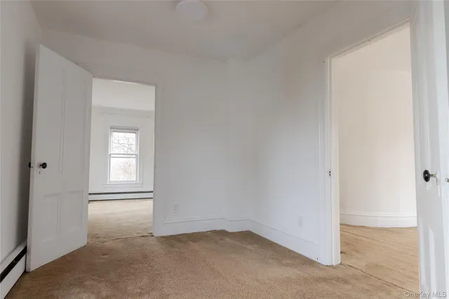 a view of a house with backyard sitting area and garden