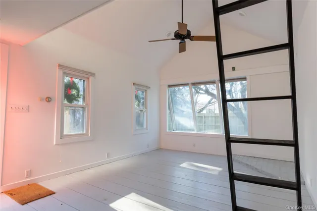 a front view of a house with wooden fence
