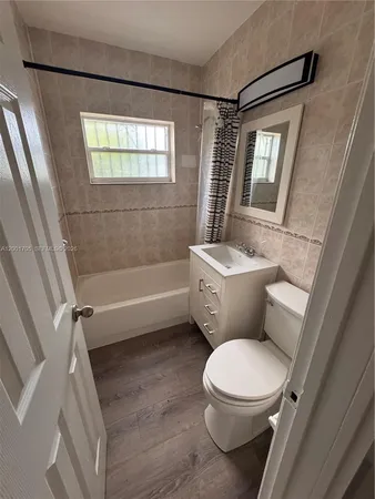 a bathroom with a toilet a sink and a bathtub