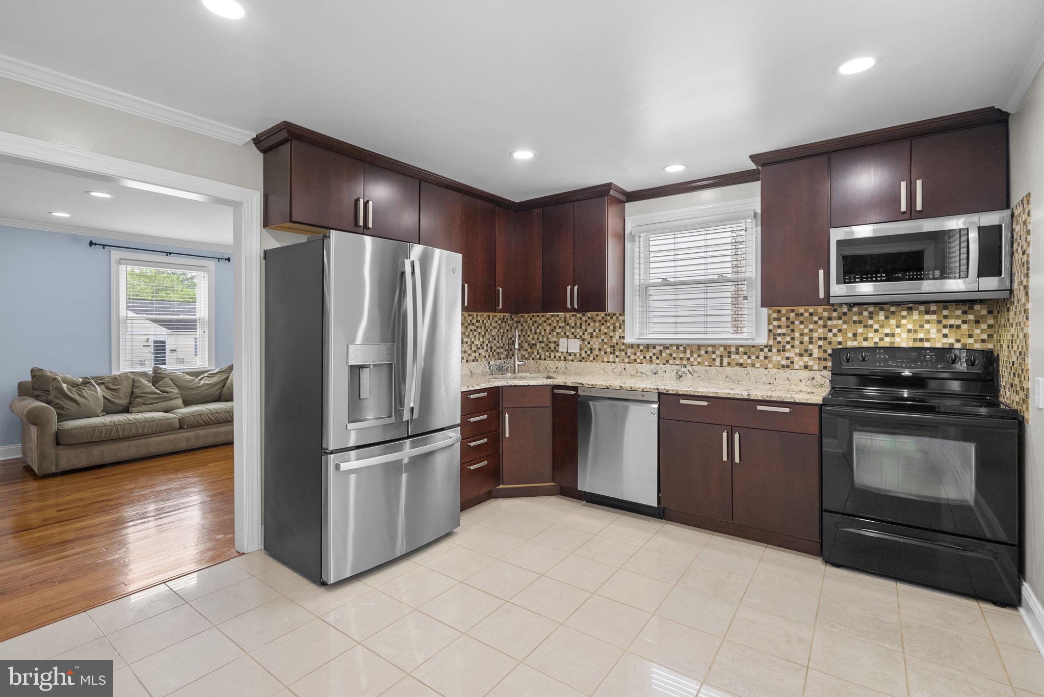 3013 Medway Street Silver Spring, MD 20902 - Photo 4 of 30 Modern kitchen with sleek finishes.