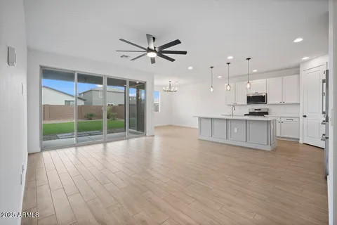 a view of kitchen with furniture and wooden floor