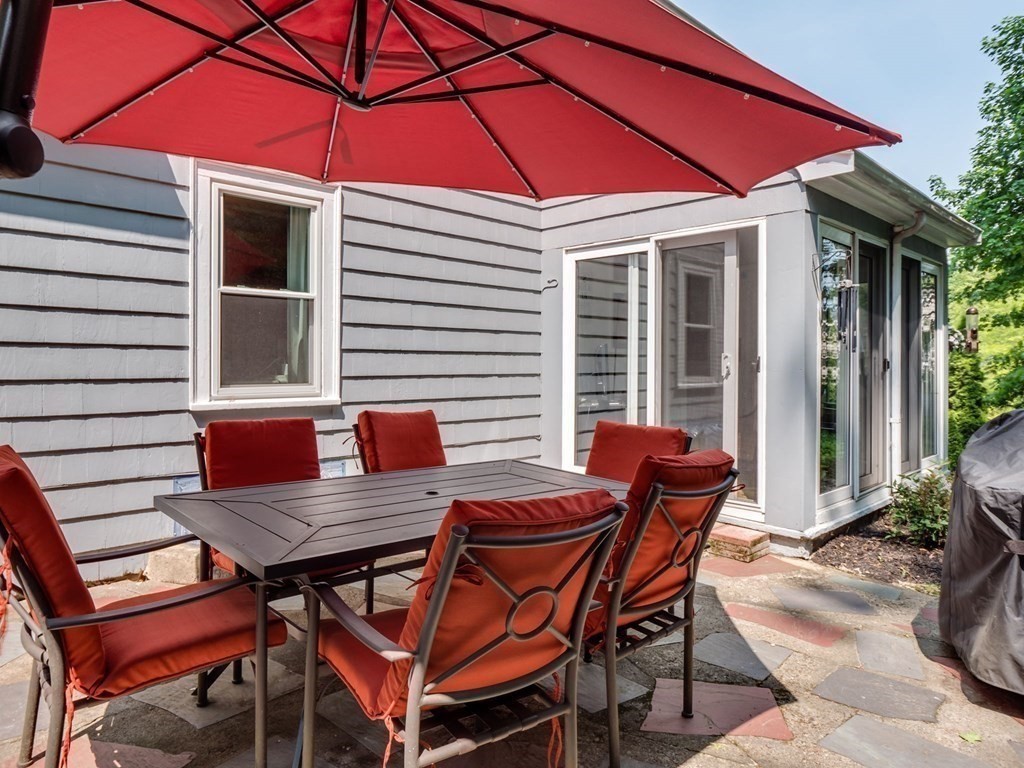 39 Echo Street Melrose, MA 02176 - Photo 11 of 32 a backyard of a house with table and chairs