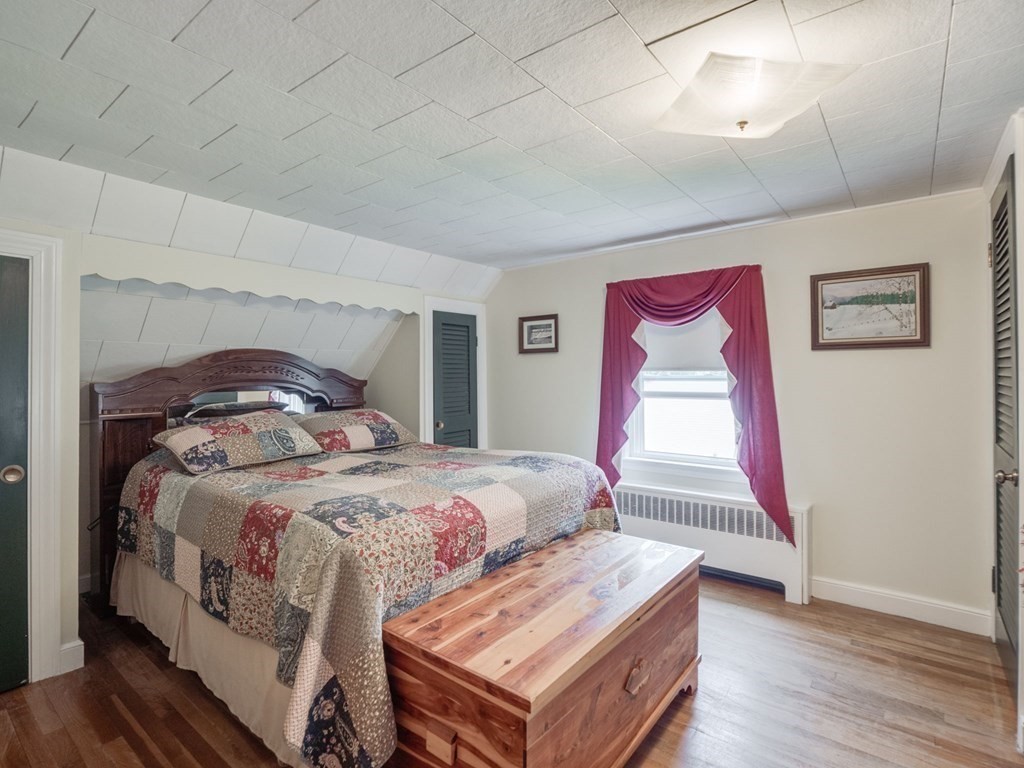 39 Echo Street Melrose, MA 02176 - Photo 15 of 32 a bedroom with bed and wooden floor