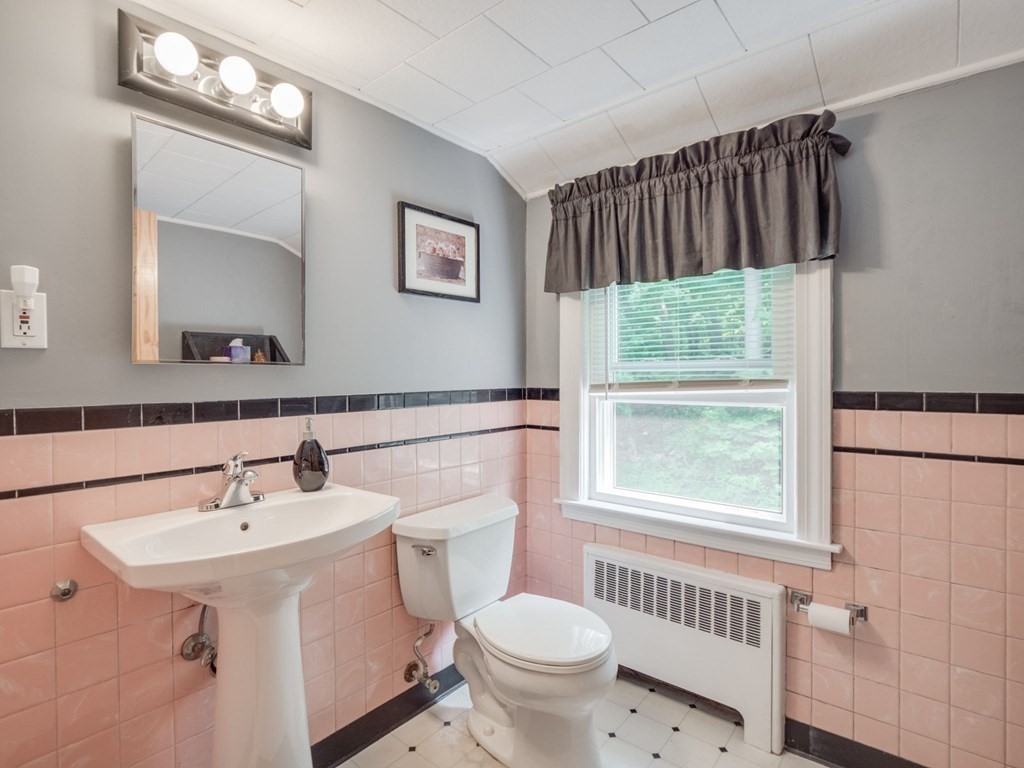 39 Echo Street Melrose, MA 02176 - Photo 17 of 32 a bathroom with a sink a toilet and shower