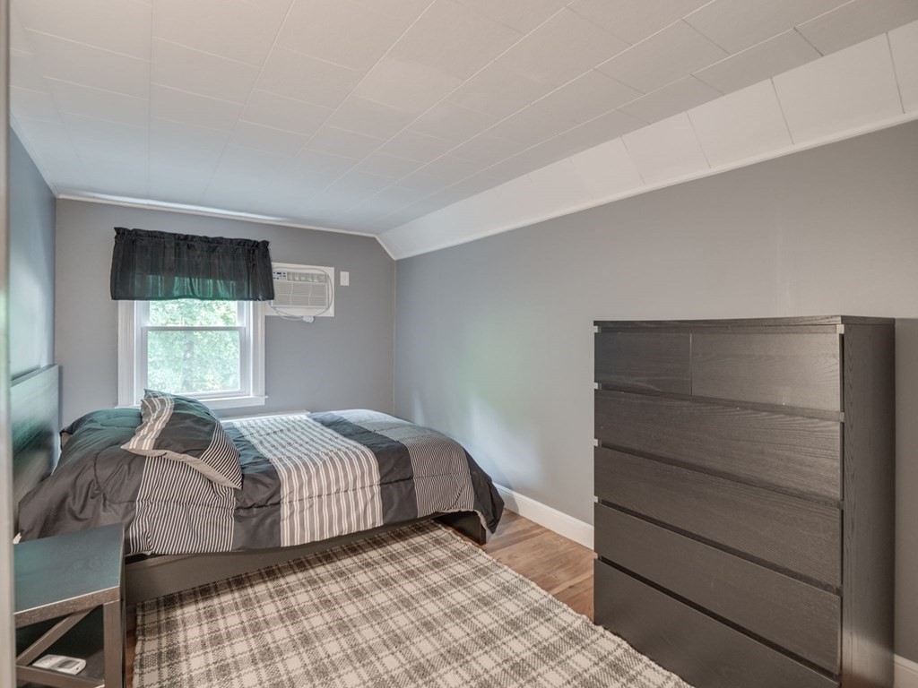 39 Echo Street Melrose, MA 02176 - Photo 20 of 32 a bedroom with a bed and a window