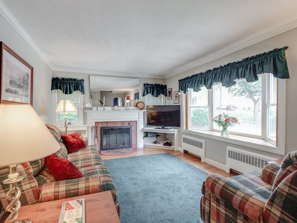 39 Echo Street Melrose, MA 02176 - Photo 2 of 32 a living room with furniture fireplace and flat screen tv