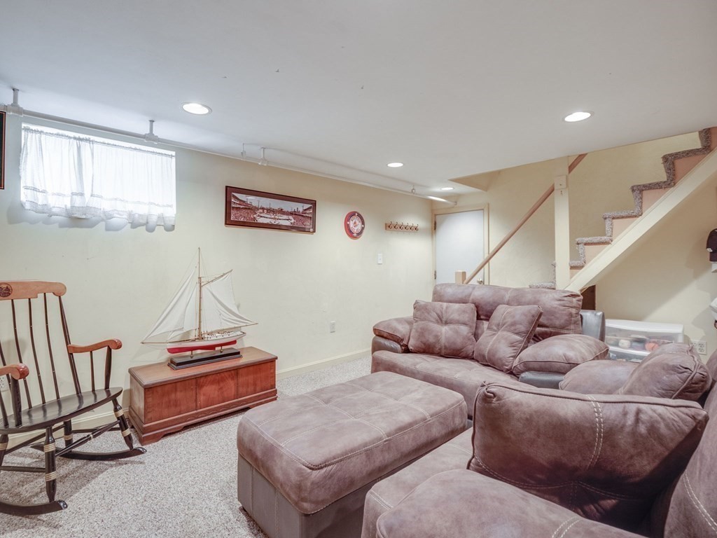 39 Echo Street Melrose, MA 02176 - Photo 22 of 32 a living room with furniture and a wooden floor