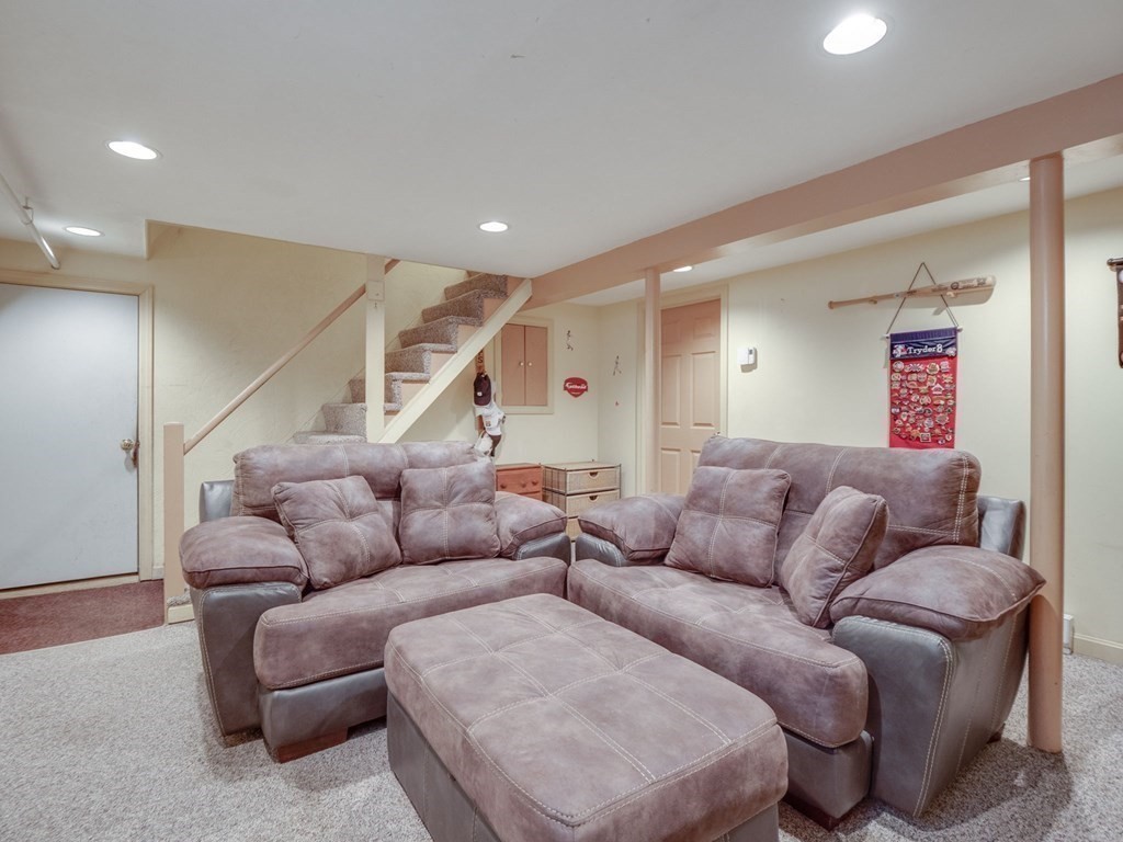 39 Echo Street Melrose, MA 02176 - Photo 23 of 32 a living room with furniture and a ceiling fan