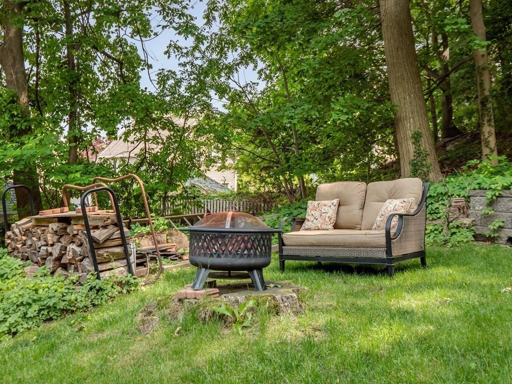 39 Echo Street Melrose, MA 02176 - Photo 28 of 32 a view of a backyard with couches plants and large trees