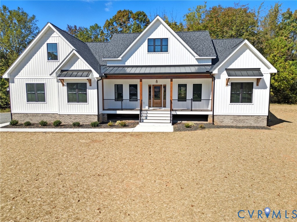 7376 River Road Hanover, VA 23069 - Photo 1 of 46 a front view of a house with a yard