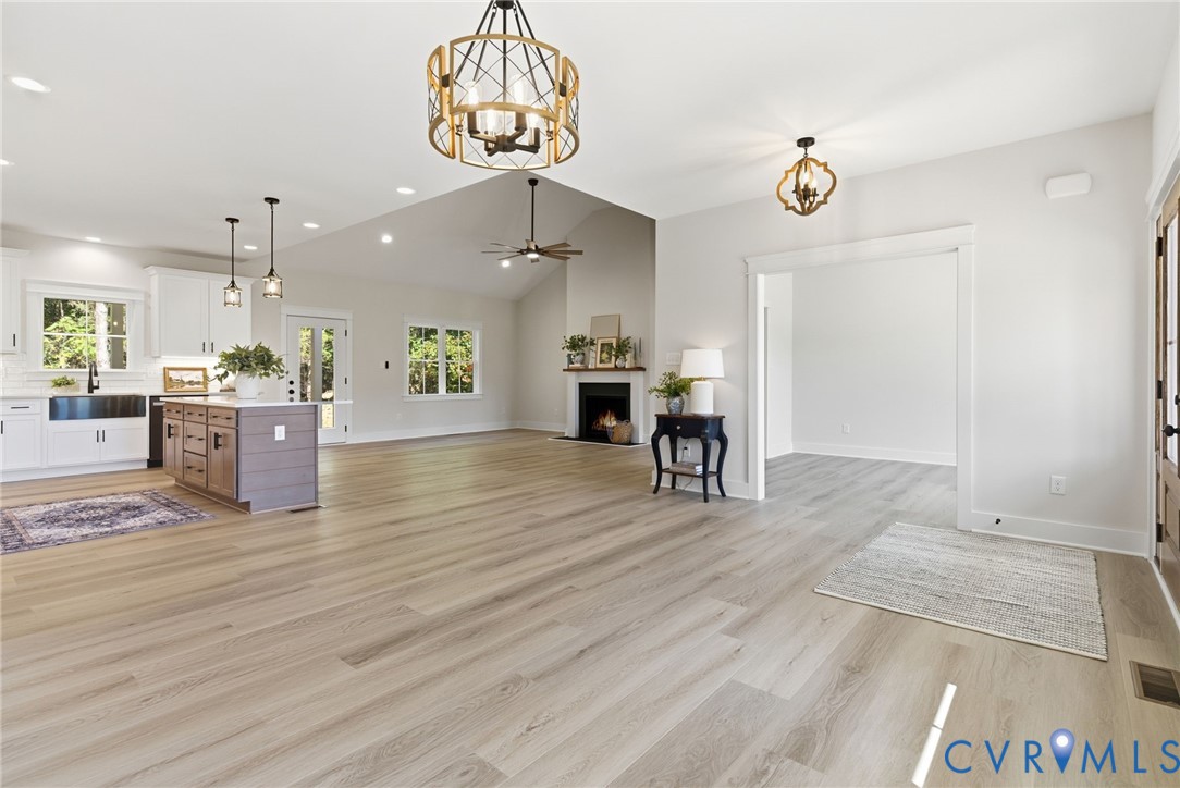 7376 River Road Hanover, VA 23069 - Photo 14 of 46 an open kitchen with a table and chairs in it