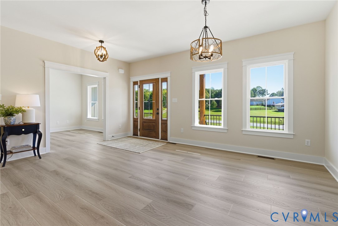7376 River Road Hanover, VA 23069 - Photo 15 of 46 a view of an room with wooden floor and windows