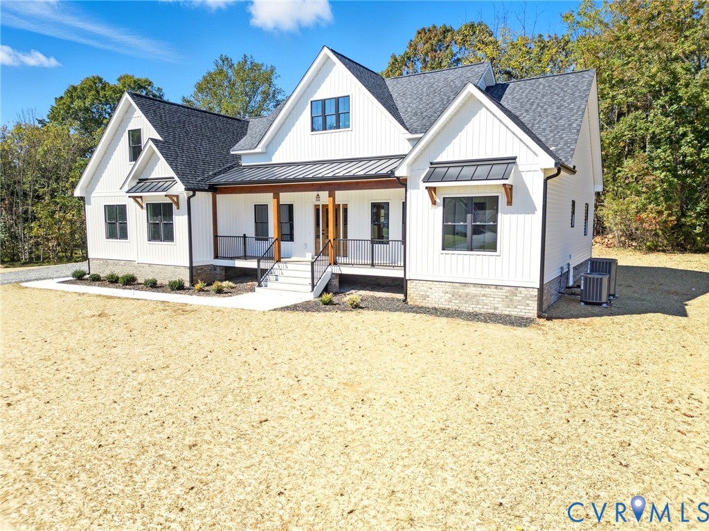 7376 River Road Hanover, VA 23069 - Photo 2 of 46 a front view of a house with a yard