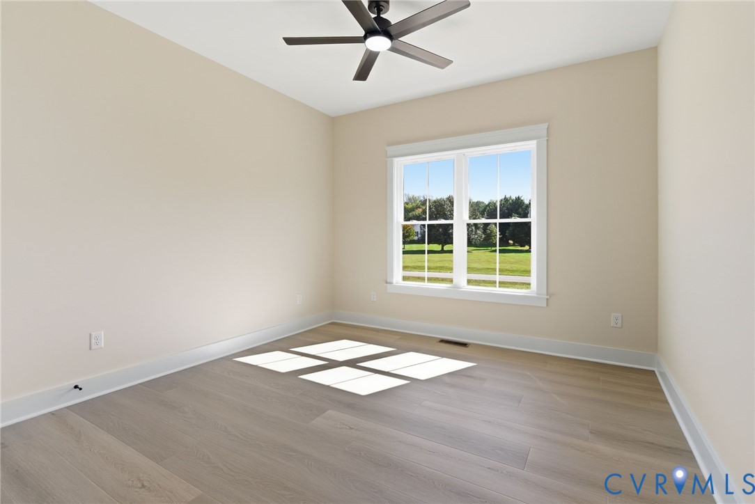 7376 River Road Hanover, VA 23069 - Photo 26 of 46 an empty room with wooden floor and windows