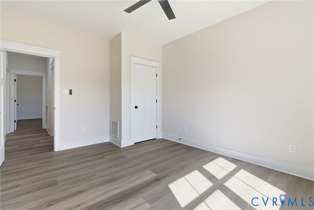 7376 River Road Hanover, VA 23069 - Photo 30 of 46 an empty room with wooden floor and window