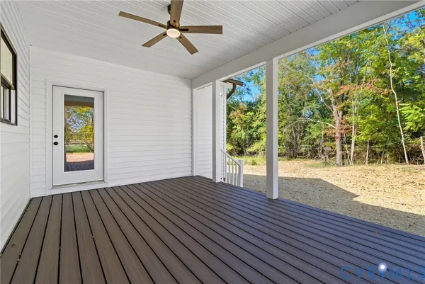 a view of outdoor space with wooden floor and windows