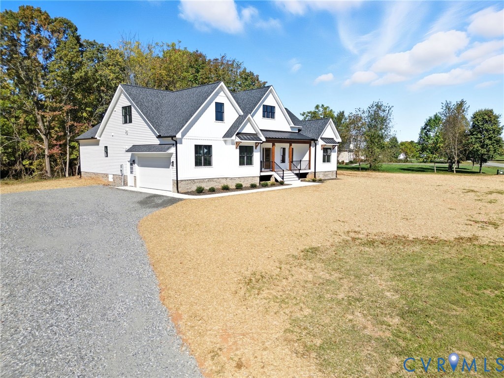 7376 River Road Hanover, VA 23069 - Photo 5 of 46 a view of house with yard and ocean view