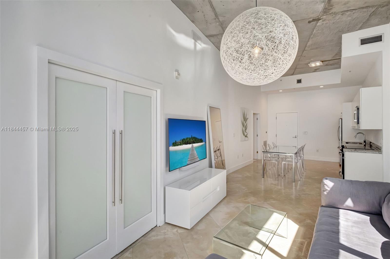 2001 Meridian Avenue, Unit PH15 Miami Beach, FL 33139 - Photo 1 of 31 a view of a livingroom with furniture and a fireplace