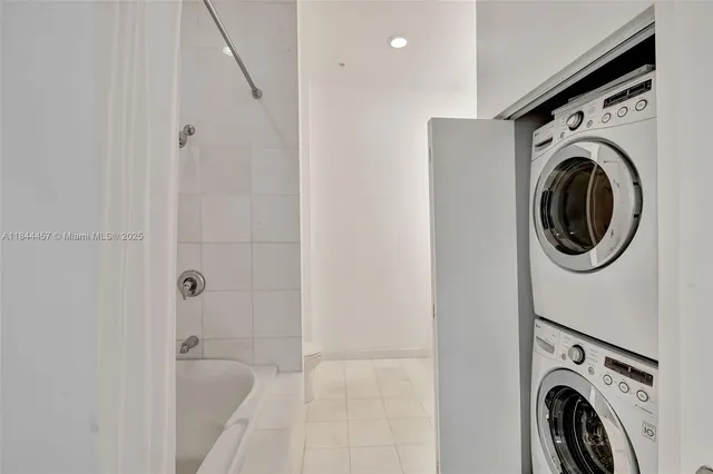 a view of a hallway with washer and dryer